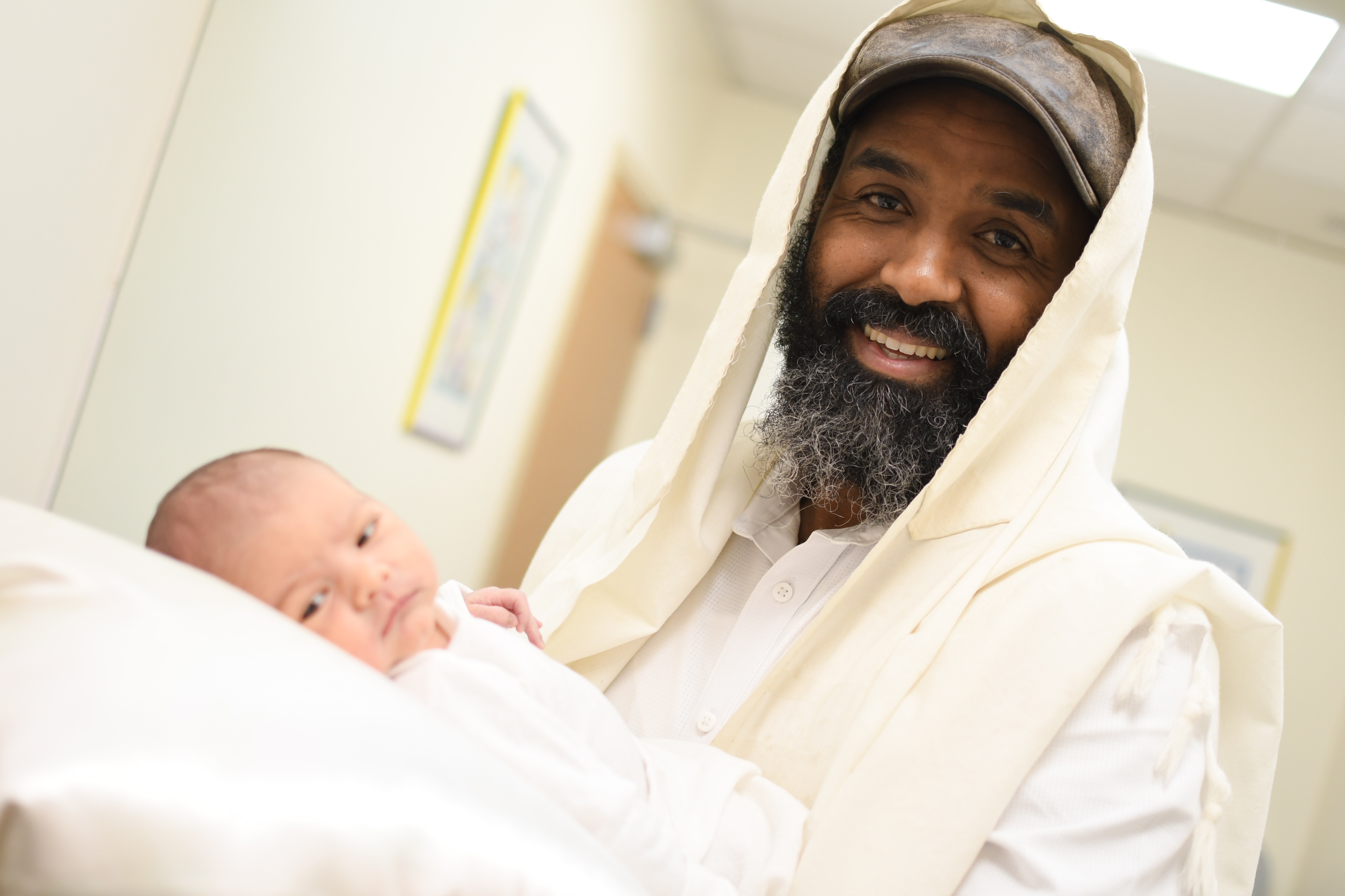 Mordechai Tasma holding baby